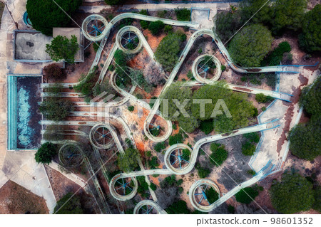 Aerial view of an abandoned old gloomy water park due to bankruptcy. Taken from a drone. Creative abstract Aerial view of an abandoned old gloomy water park due to bankruptcy. Taken from a drone. Creative abstract 98601352