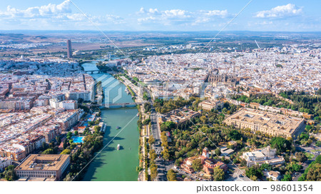 Aerial view of the Spanish city of Seville in the Andalusia region on the river Guadaquivir overlooking cathedral and Real Alcazar 98601354
