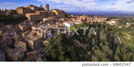 Italy travel and landmarks. Tuscany region, aerial panoramic view of old town Montalcino Italy travel and landmarks. Tuscany region, aerial panoramic view of old town Montalcino 98601547