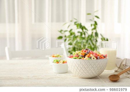 Concept of breakfast food, colorful corn flakes, space for text 98601979