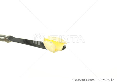 Knife with butter isolated on white background 98602012