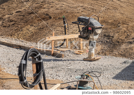 Civil engineering works: stake setting and tamping rammer 98602095