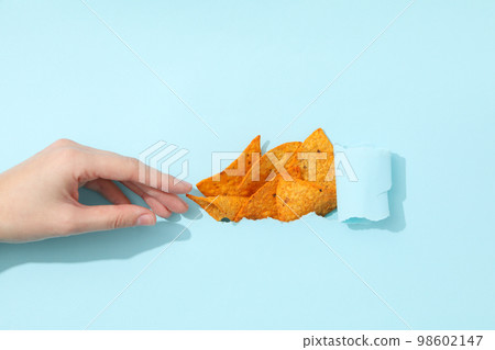Concept of tasty snacks, tasty corn chips Concept of tasty snacks, tasty corn chips 98602147