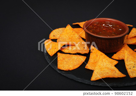 Concept of tasty snacks, corn chips, space for text Concept of tasty snacks, corn chips, space for text 98602152