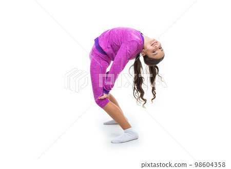 cheerful flexible teen girl stretching in studio. flexible teen girl stretching on background. 98604358