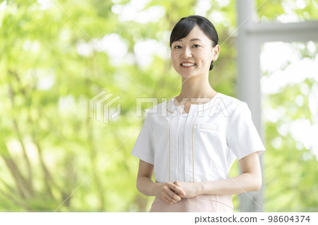 Image of a smiling esthetician looking at the camera Image of a smiling esthetician looking at the camera 98604374