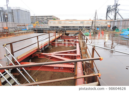 Underpass construction site passing under the railroad tracks Underpass construction site passing under the railroad tracks 98604626