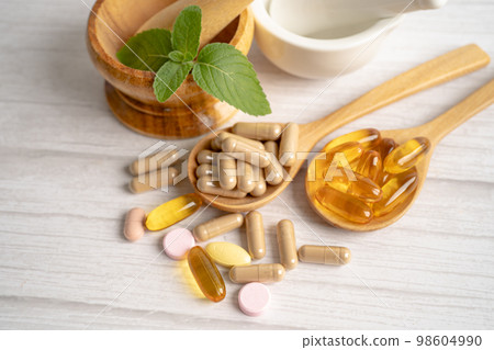 Alternative medicine herbal organic capsule drug with herbs leaf natural supplements for healthy good life. 98604990