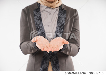 a beautiful woman with hijab standing with hands opened 98606718