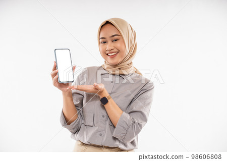 a woman in brown veil standing with smile and showing the phone a woman in brown veil standing with smile and showing the phone 98606808