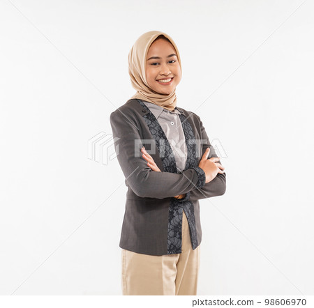 a beautiful woman with hijab standing with hand crossed and cheerful face 98606970