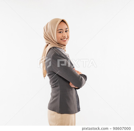 a beautiful woman with hijab standing facing left with hand crossed 98607000