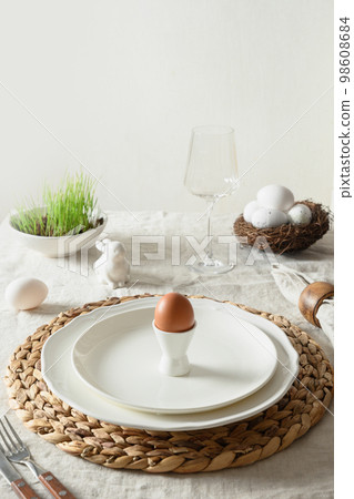 Easter table setting with organic eggs, festive spring decorations. Easter table setting with organic eggs, festive spring decorations. 98608684
