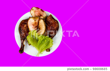 Traditional France dish duck confit with baked apple on isolated background top view copy space 98608685