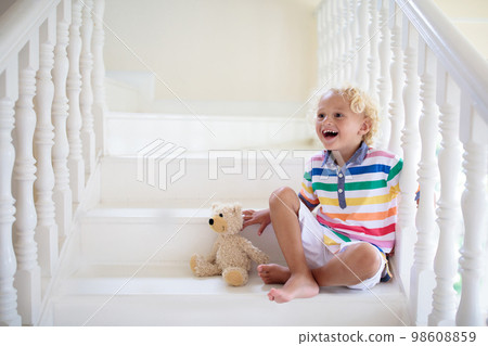 Kids on stairs. Child moving into new home. Kids on stairs. Child moving into new home. 98608859