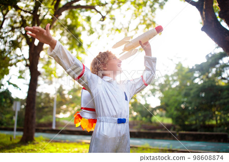 Little boy playing with spaceship. Astronaut kid. 98608874