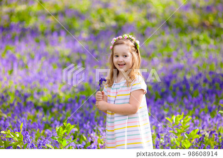 Kids playing in bluebell woods 98608914