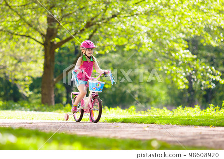 Child riding bike. Kid on bicycle. 98608920