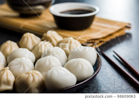 Xiaolongbao, traditional steamed dumplings. Xiao Long Bao buns on plate. 98609063