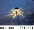A light that shines in the snow 98610621