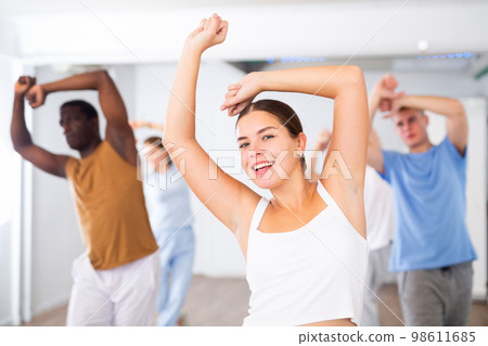 Young woman learning dance in dance studio 98611685