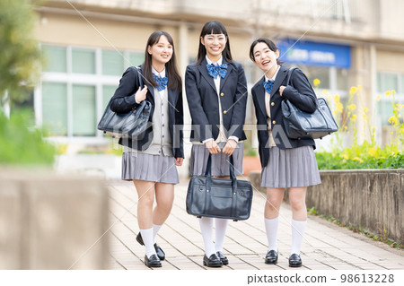 High school girl attending school uniform 98613228
