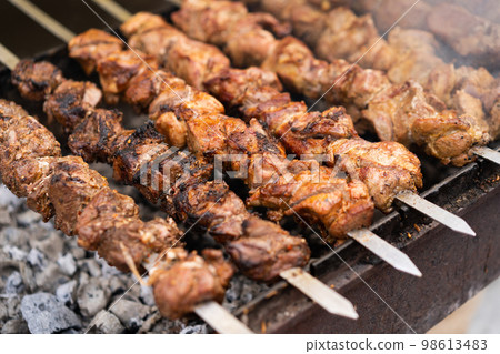delicious and fragrant meat, skewers on grill 98613483