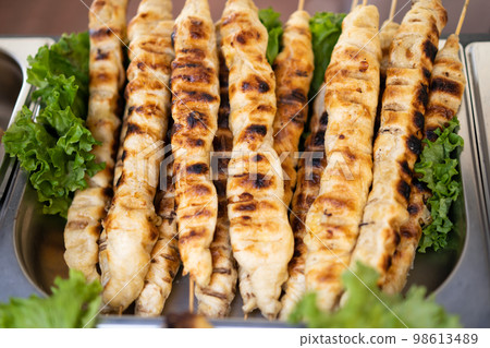 baked dough on the grill on a stick baked dough on the grill on a stick 98613489