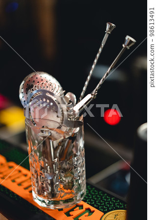 accessories of a bartender for preparation of an alcoholic cocktail. accessories of a bartender for preparation of an alcoholic cocktail. 98613491