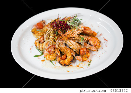 close up of a good serving of delicious shrimp in a restaurant 98613522
