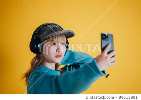 A woman taking self-taking 98613981