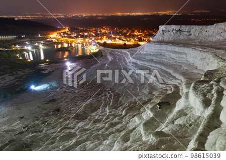 Pamukkale on the top with a view of the city of Denizli at night, Turkey. Pamukkale on the top with a view of the city of Denizli at night, Turkey. 98615039