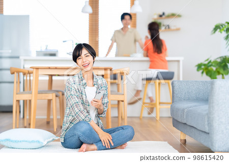 Friends men and women share house lifestyle living room 98615420