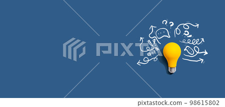 Brainstorming concept with a light bulb Brainstorming concept with a light bulb 98615802