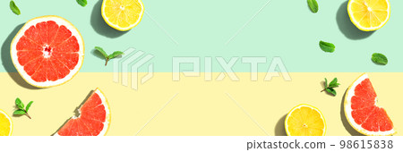 Fresh grapefruits and lemons overhead view 98615838