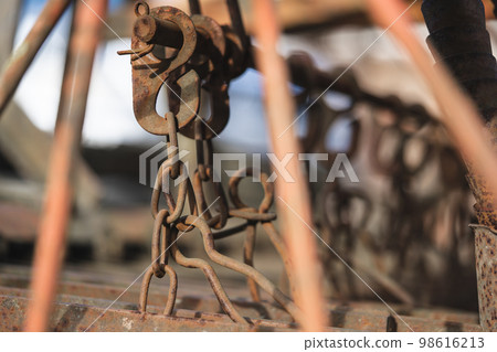 close-up of an old rusty chain for fastening various accessories in the household 98616213