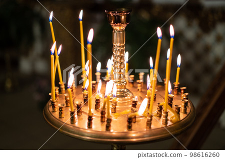 many candles in the church 98616260
