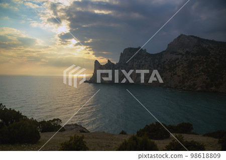 View of Karaul-Oba mountain,Cape Chicken-Kaya and Blue bay on sunset. Noviy Svet. Crimea 98618809