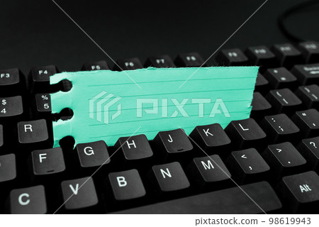 Colored sticker lying on black keyboard. Important information written over paper. Image with school supplies. Multiple Assorted Collection Office Stationery. Colored sticker lying on black keyboard. Important information written over paper. Image with school supplies. Multiple Assorted Collection Office Stationery. 98619943