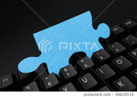 Colored sticker lying on black keyboard. Important information written over paper. Image with school supplies. Multiple Assorted Collection Office Stationery. Colored sticker lying on black keyboard. Important information written over paper. Image with school supplies. Multiple Assorted Collection Office Stationery. 98620516