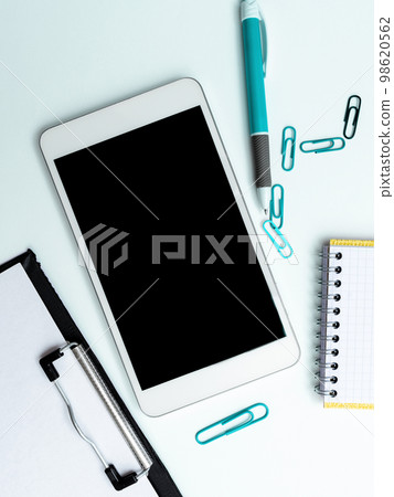 Phone Screen With Important Message On Desk With pens, Calculator And Notebook. Cellphone With Crutial Information On Table With Cup. Late Updates Presented. 98620562