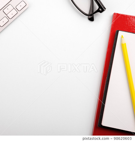 Different Office Supplies, Colored Stickers, Notebooks. Pens, Pencils, Rullers, Marckers. Different School Items. Important information. Accessories lying on desk. 98620603