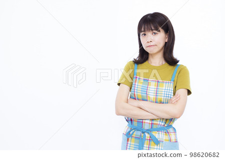 Housewife in her thirties worried with her arms folded 98620682