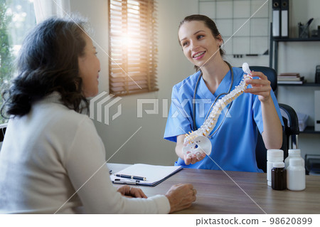 Home healthcare nurse, physical therapy with senior adult woman at home Home healthcare nurse, physical therapy with senior adult woman at home 98620899