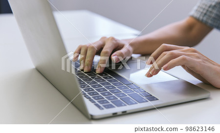 Woman hand using laptop or computor searching for information in internet online society web.  98623146