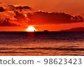 The sun setting over the horizon dyed in orange 98623423