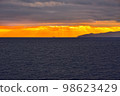 Evening sun shining over the sea 98623429