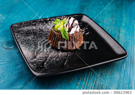 Chocolate brownie with vanilla ice cream Chocolate brownie with vanilla ice cream 98623963