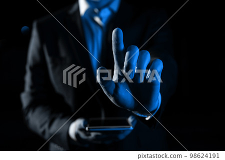 Man Holding Mobile Phone and Point On Recent Updates With One Finger. Businessman Having Virtual Reality Eyeglasses, Cellphone And Presenting New Idea. Man Holding Mobile Phone and Point On Recent Updates With One Finger. Businessman Having Virtual Reality Eyeglasses, Cellphone And Presenting New Idea. 98624191