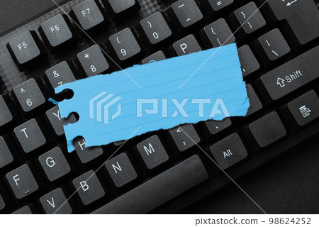 Colored sticker lying on black keyboard. Important information written over paper. Image with school supplies. Multiple Assorted Collection Office Stationery. Colored sticker lying on black keyboard. Important information written over paper. Image with school supplies. Multiple Assorted Collection Office Stationery. 98624252